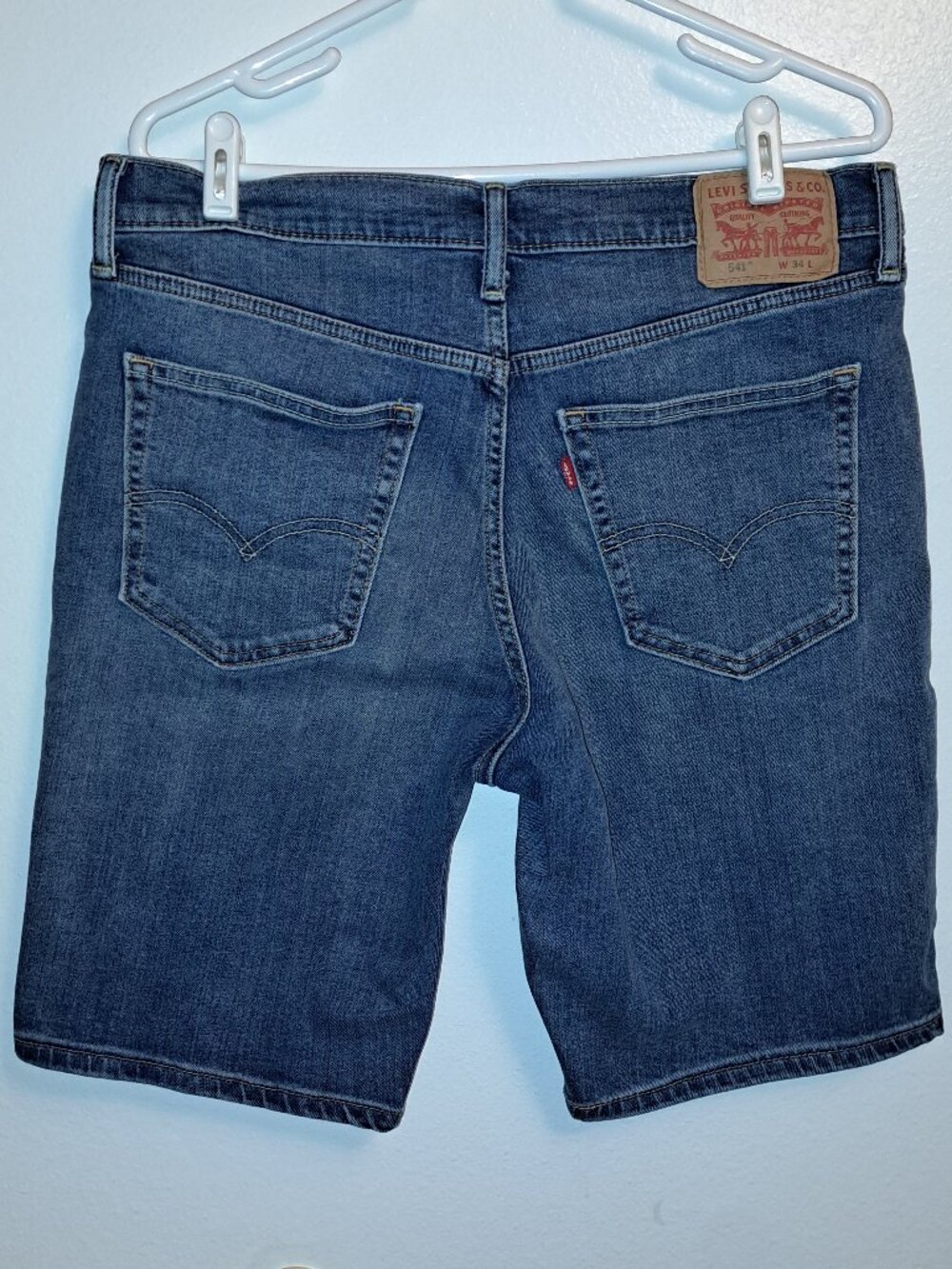 Levi's 541 Athletic Taper jean shorts in a classic medium wash.